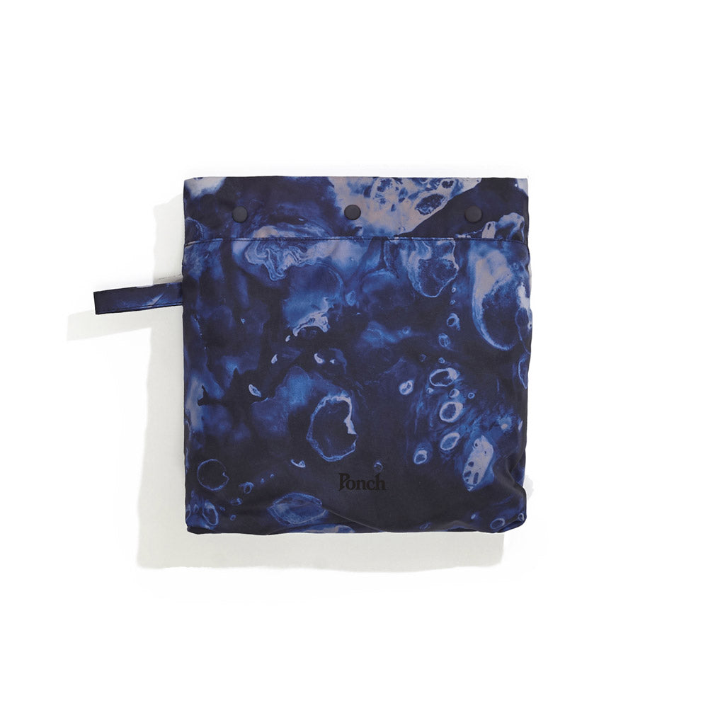 Packed away image of blue Leif Podhajsky print packable rain Poncho by Ponch